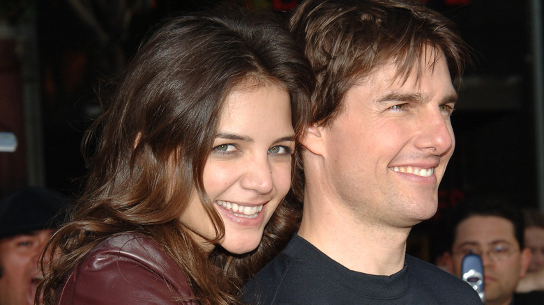Katie Holmes posing with Tom Cruise, smiling