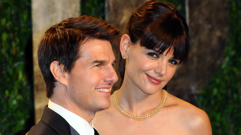 Katie Holmes with Tom Cruise, both smiling