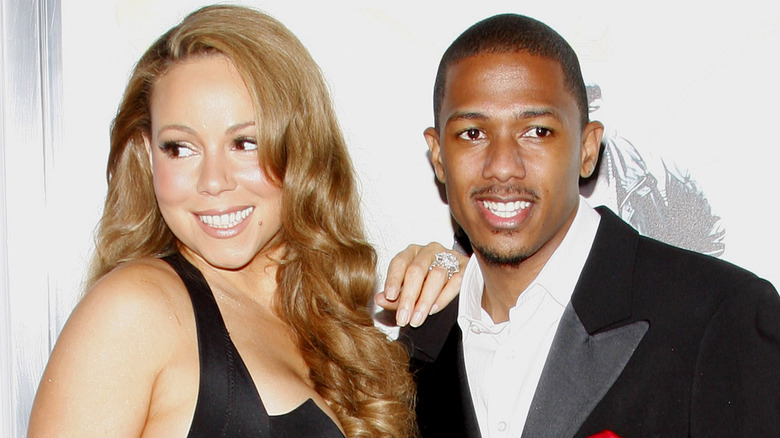 Mariah Carey with Nick Cannon, both posing