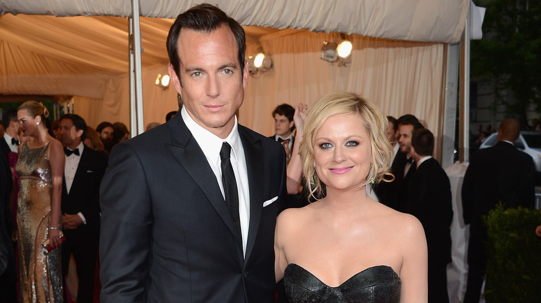 Amy Poehler and Will Arnett smiling