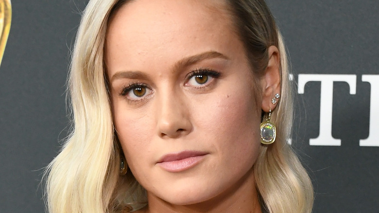 Brie Larson at an event, looking serious