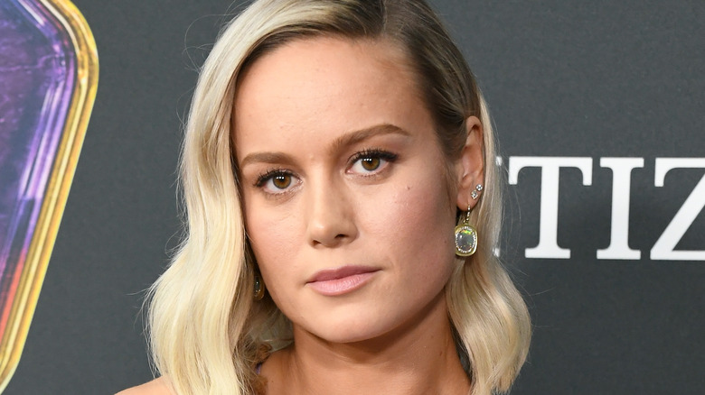 Brie Larson at an event, looking serious