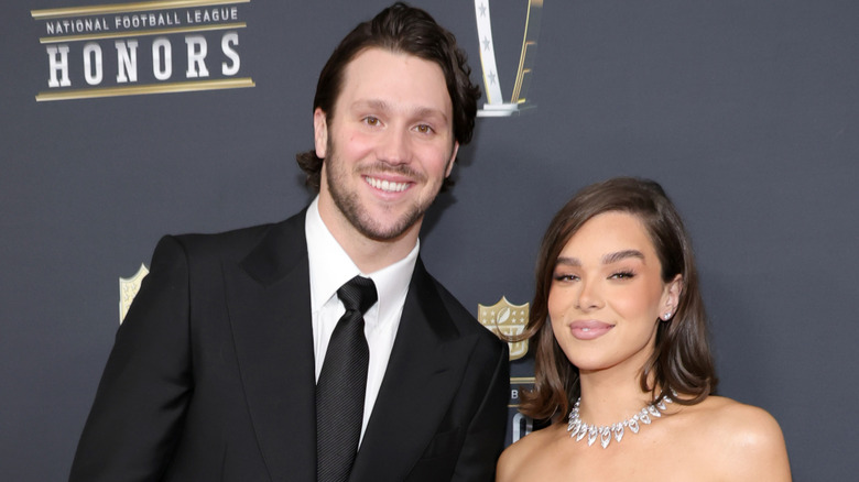 Josh Allen and Hailee Steinfeld smiling at an event