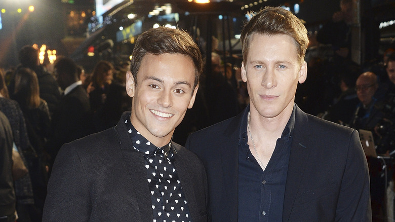 Tom Daley, Dustin Lance Black both posing