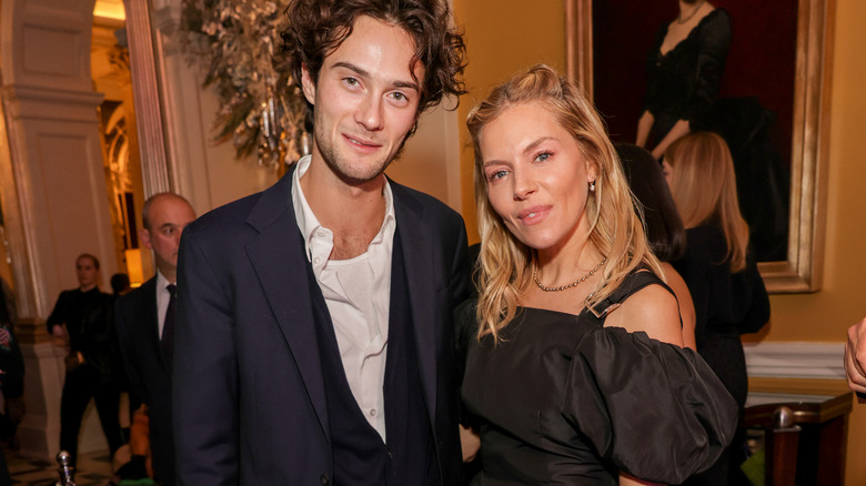 Sienna Miller and Oli Green smiling