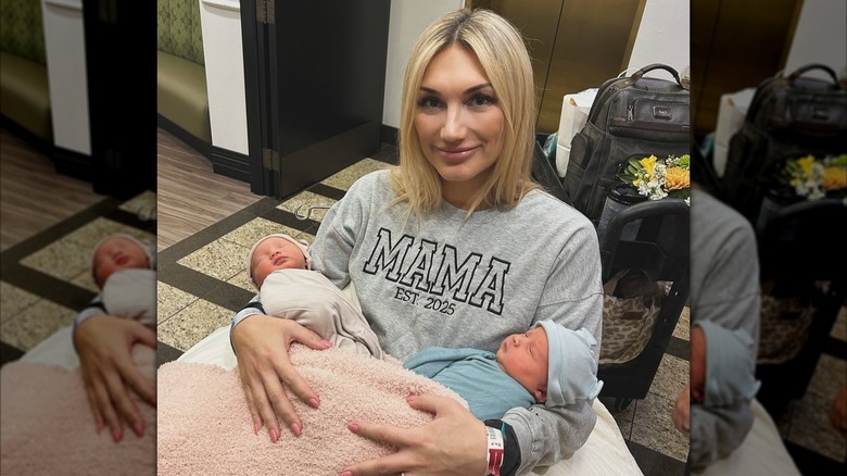 Brooke Hogan posing with her newborn twins