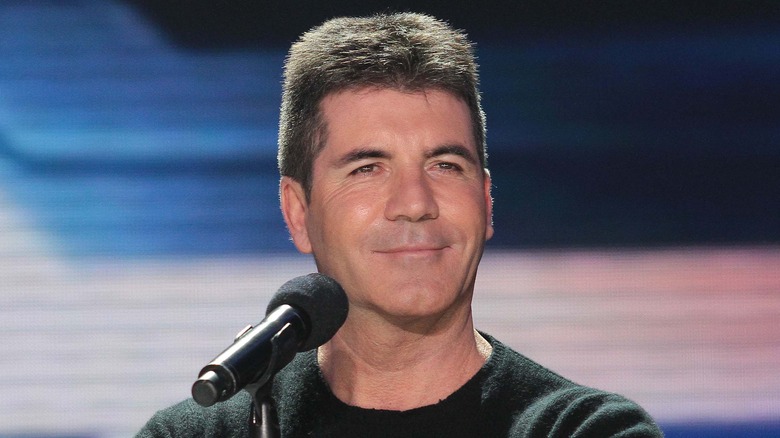 Simon Cowell smiling microphone