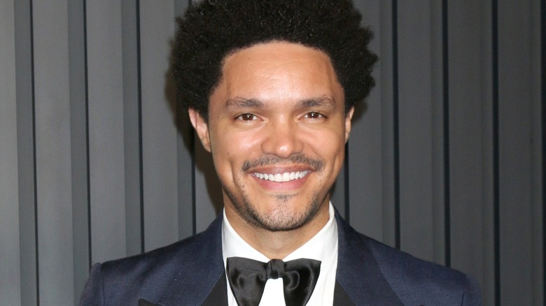 Trevor Noah in a black tuxedo