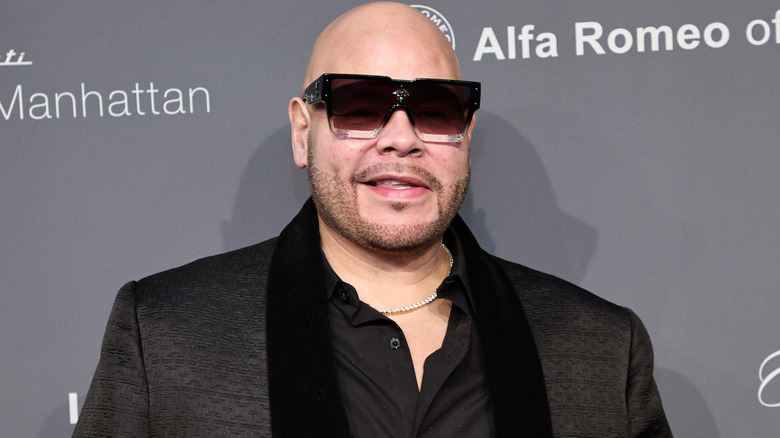 Fat Joe smiles in sunglasses