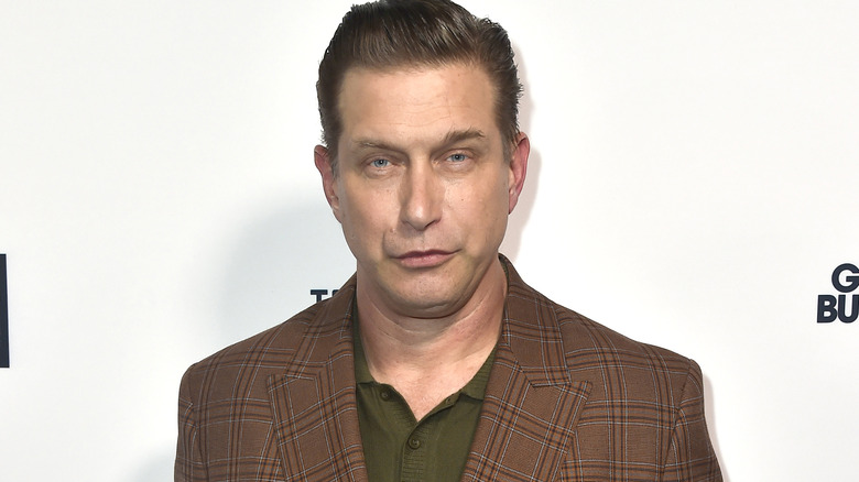 Stephen Baldwin pouting, plaid coat