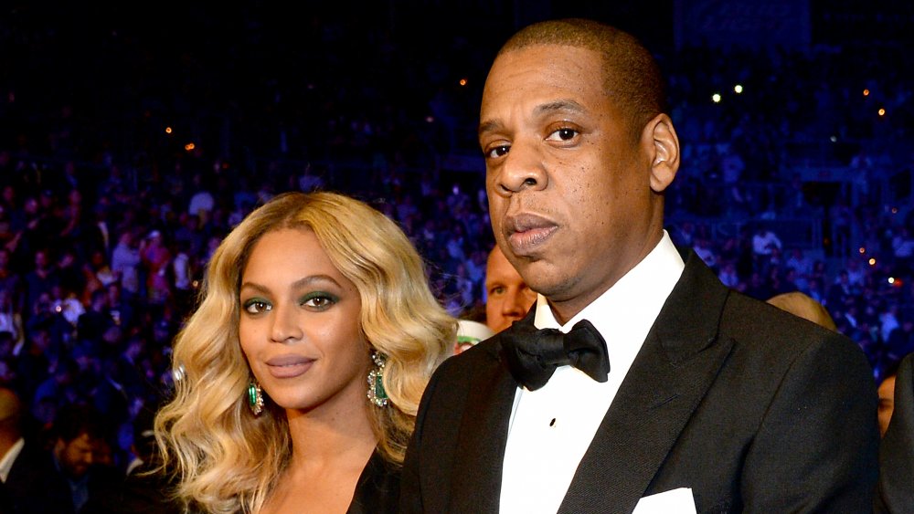 Beyoncé with blonde hair, next to Jay Z
