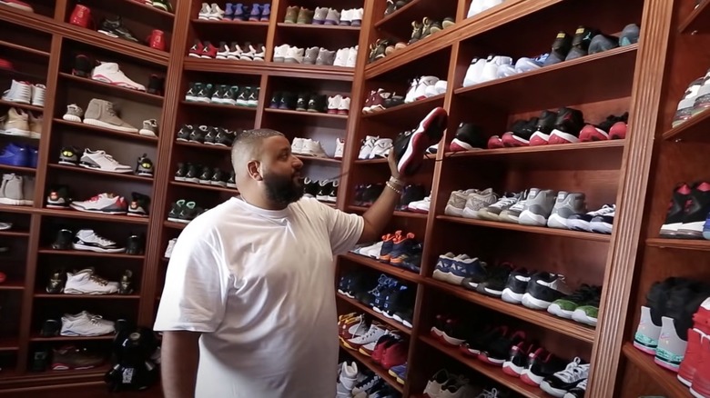 DJ Khaled standing in his shoe closet