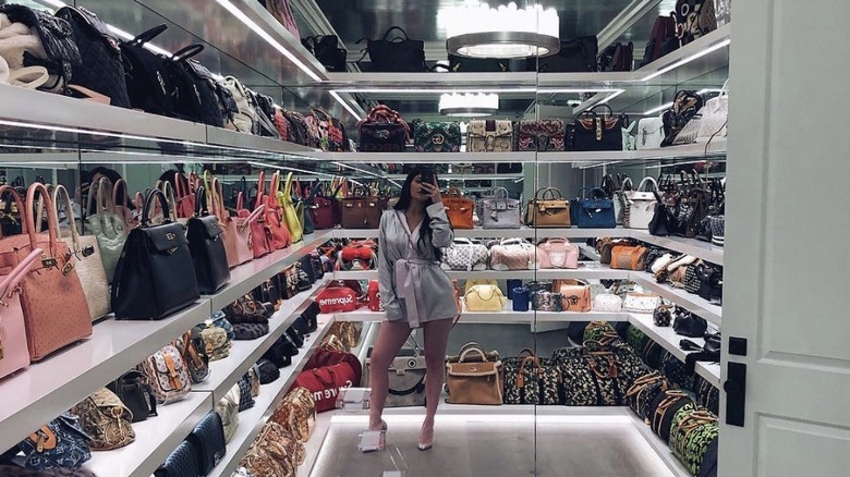 Kylie Jenner taking a selfie in her purse closet