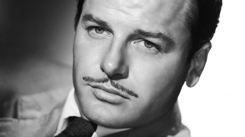 Gig Young posing