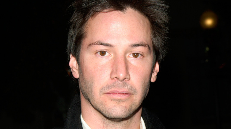 Keanu Reeves poses 