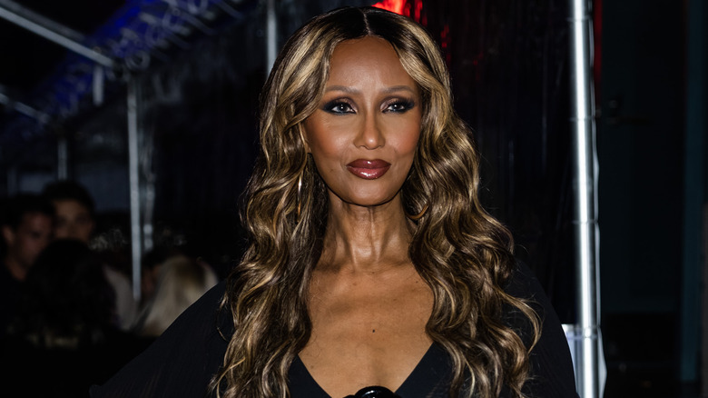 Iman smiling black dress at event