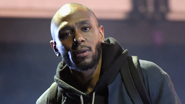 Yasiin Bey wearing a hoodie