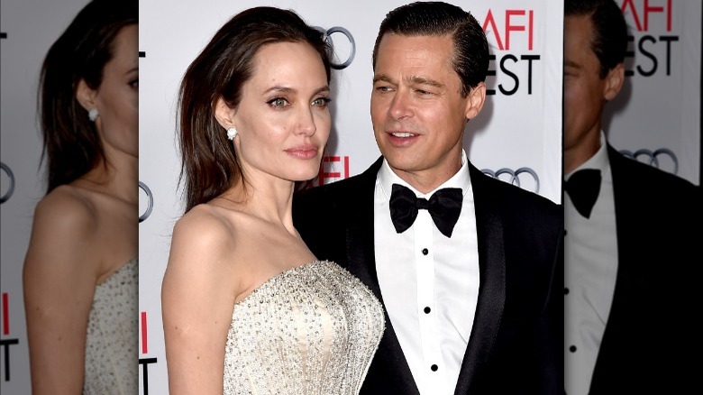 Brad Pitt posing with Angelina Jolie
