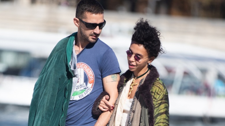 Shia LaBeouf and FKA Twigs arm in arm