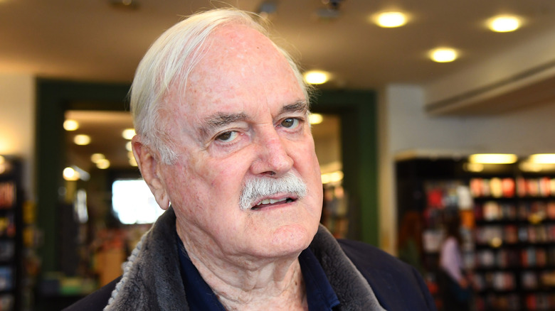 John Cleese sneering