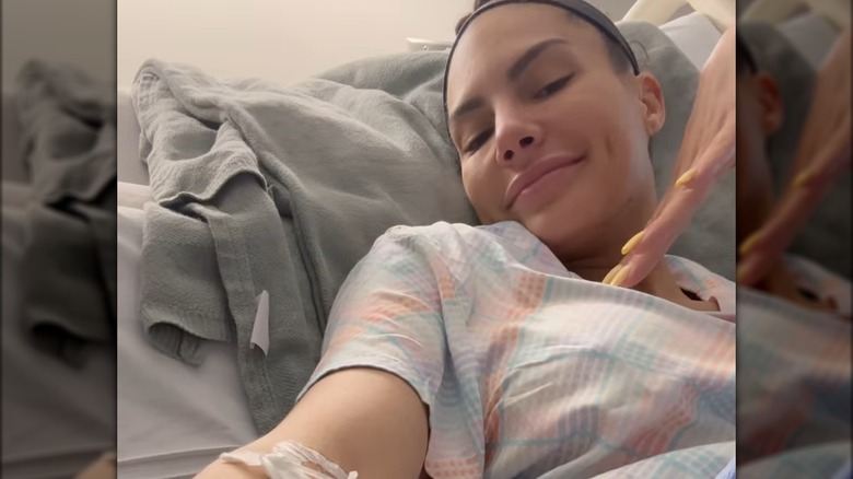 Amanza Smith taking a selfie in a hospital bed