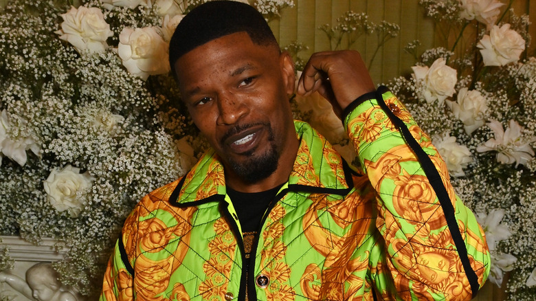 Jamie Foxx posing in Versace jacket