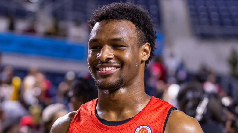 Bronny James smiling in basketball jersey