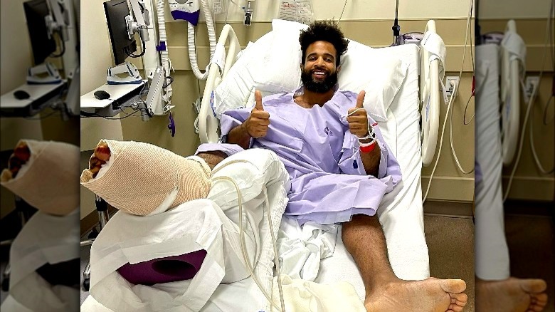 Nelson Thomas giving thumbs up in hospital