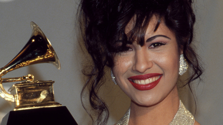 Selena Quintanilla-Pérez posing with her Grammy