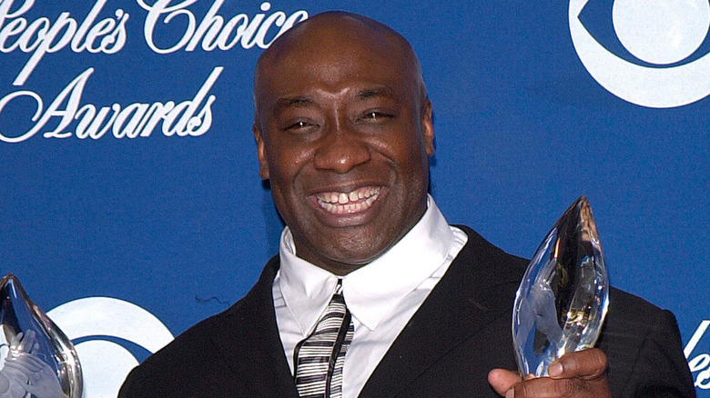 Michael Clarke Duncan holding two awards