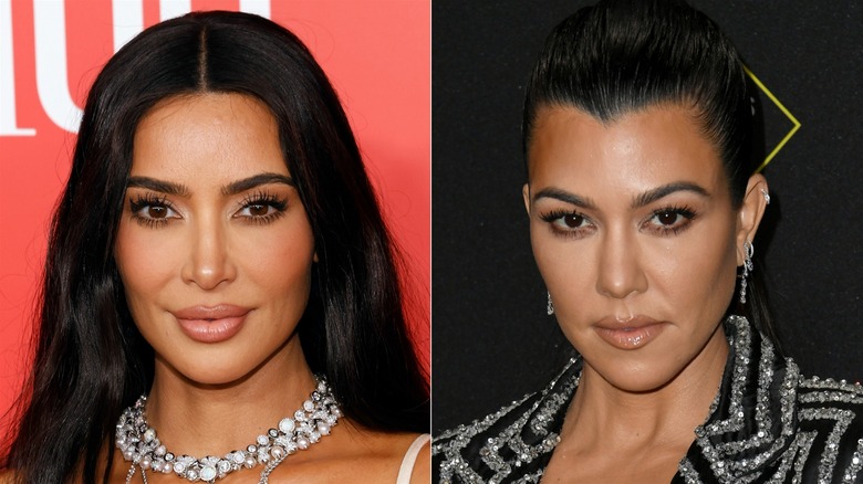 Kim and Kourtney Kardashian posing