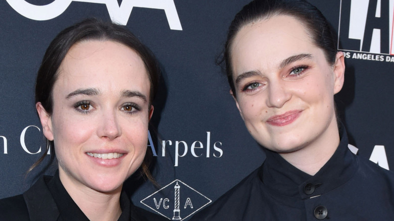 Elliot Page and Emma Portner smiling together