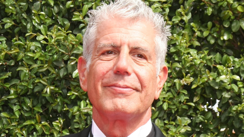 Anthony Bourdain smiling in tuxedo 