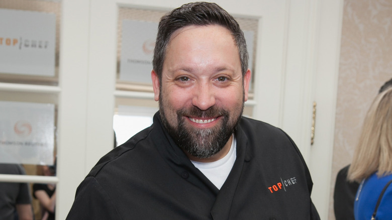 Mike Isabella smiling at event