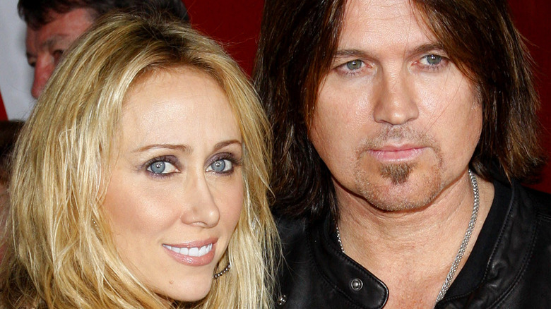 Tish Cyrus and Billy Ray Cyrus posing together