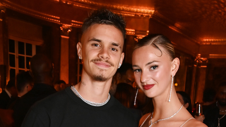 Romeo Beckham and Mia Regan smiling