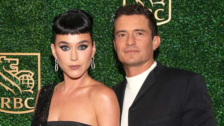 Katy Perry and Orlando Bloom posing at event