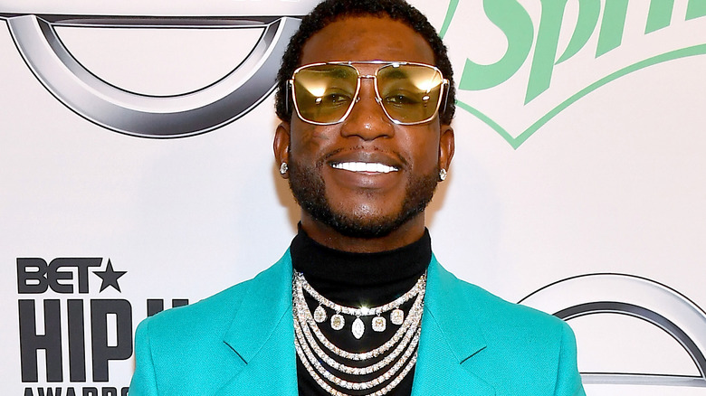 Gucci Mane smiling in diamond necklace