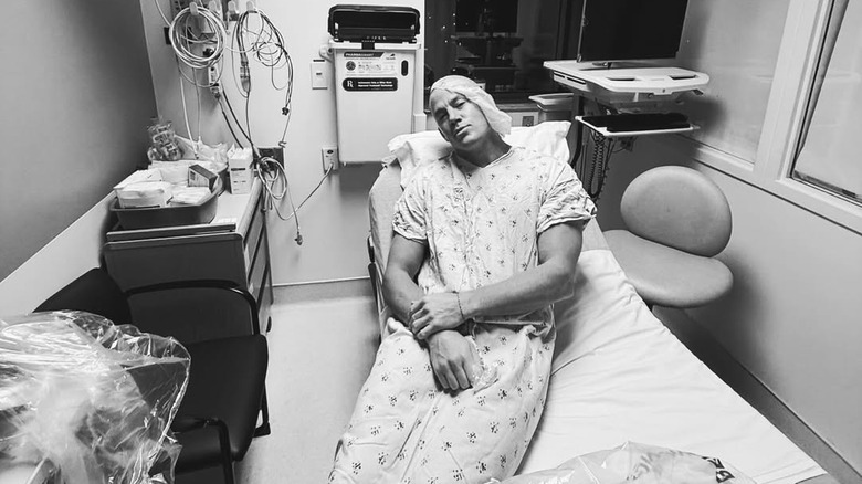 Channing Tatum posing in a hospital gown and bed