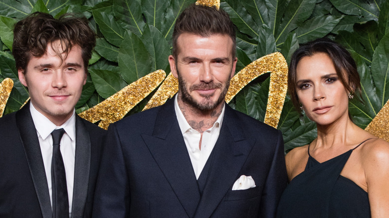 Brooklyn Beckham with parents David Beckham and Victoria Beckham