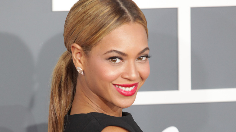 Beyoncé smiling over shoulder