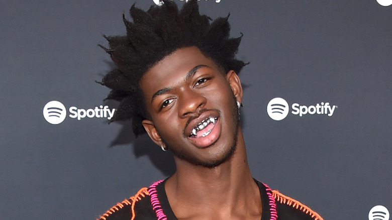 Lil Nas X wearing fangs