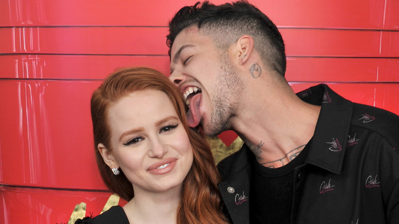 Travis Mills kissing Madelaine Petsch's head