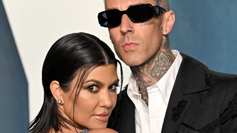 Kourtney Kardashian and Travis Barker pose together