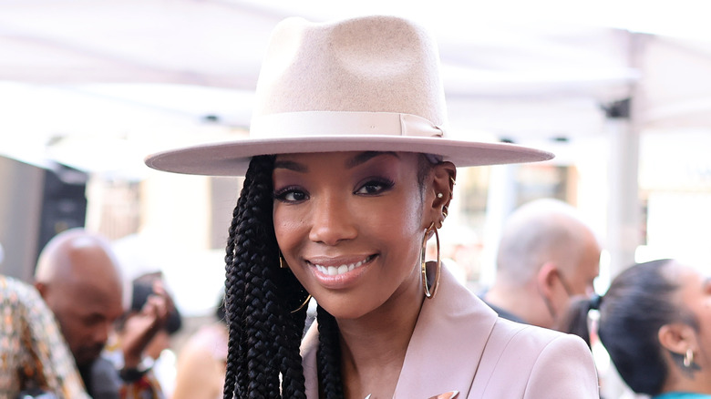 Brandy smiling in a giant hat