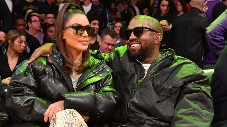 Kanye West and Kim Kardashian at a sports game