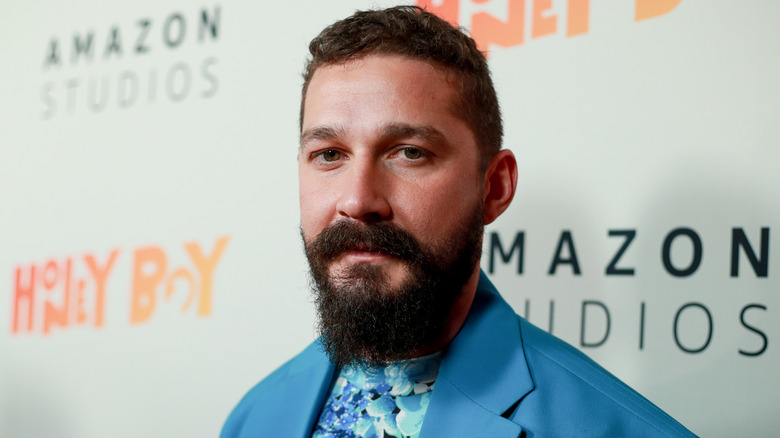 Shia LaBeouf posing in blue suit