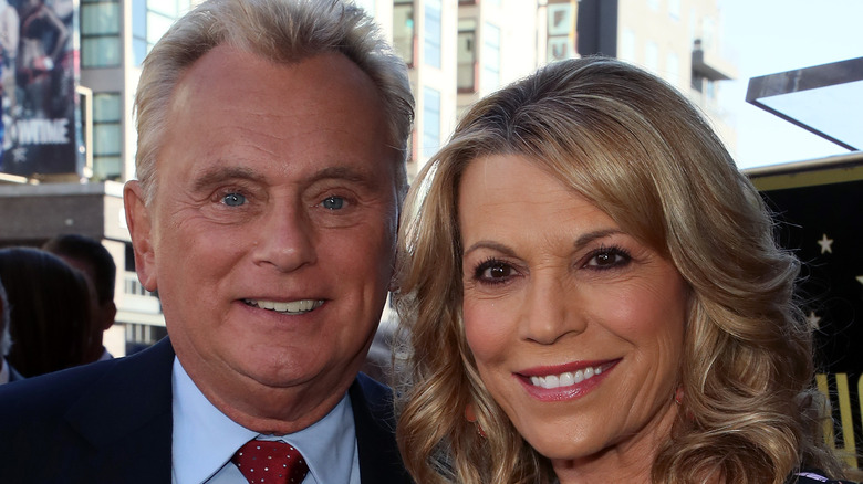 Vanna White and Pat Sajak smile