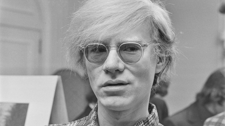 Andy Warhol wearing glasses