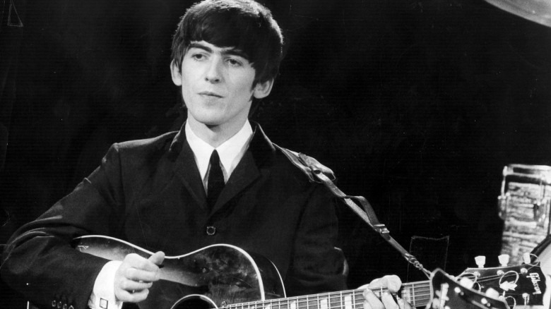 George Harrison playing guitar